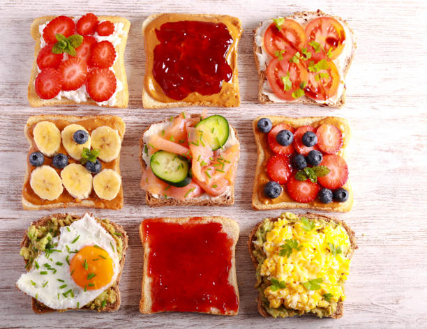 istock Selection of breakfast toasts with different toppings - savory and sweet. 1482405894