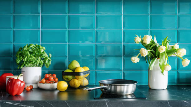 istock cozy kitchen with induction hob, cookware, fruits and vegetables 1482406885