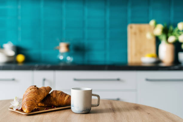 istock mug with drink and homemade pastry on table at home 1482406917