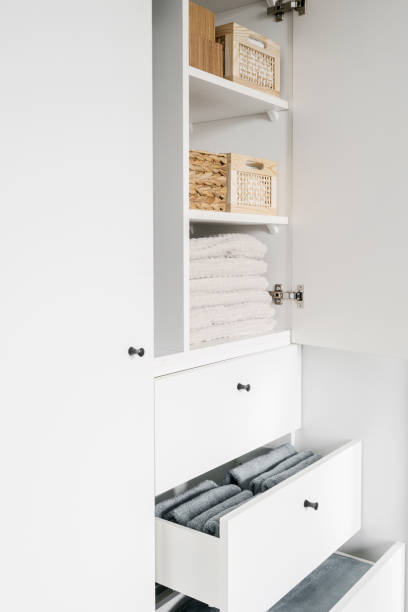 istock storage bamboo boxes with clean linen in white cabinet 1482406969