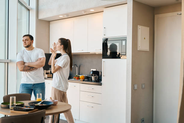 istock Man and a woman emotionally sort things out in kitchen 1482408138