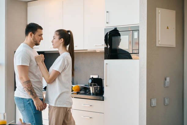 istock Husband and wife emotionally sort things out in the kitchen 1482408141