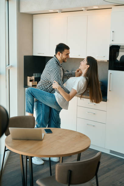 istock Happy beautiful young couple dancing tango in the kitchen 1482408171