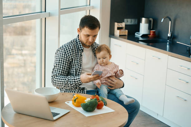 istock Male in home clothes sits at the kitchen table 1482408490