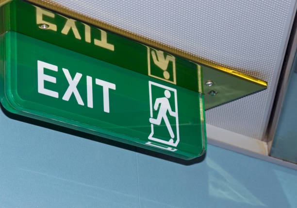 Exit sign on ceiling stock photo