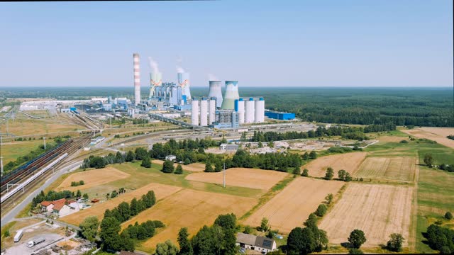 Aerial view of modern coal-fired power plant with a railway siding in Opole, Poland