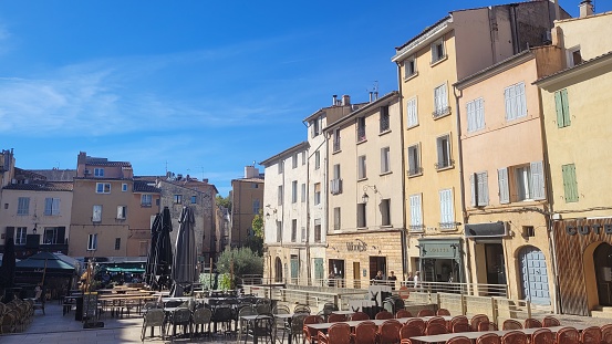 In October 2022, lots of restaurants were ready to welcome people and tourists at their restaurant during a sunny synday at the famous Place des Cardeurs in Aix-en-Provence in South of France.