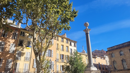 Street view on the beautiful residential buildings andchurch tower in Nantes city during the sunny day in France