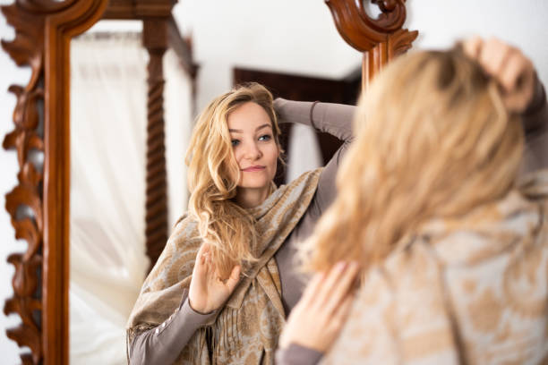 istock Pretty, young woman  in front of a mirror 1482421626
