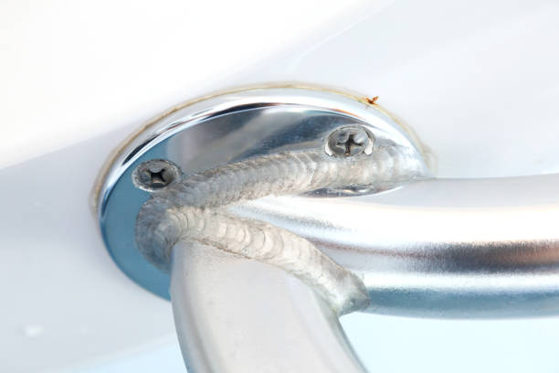 istock Welding joint of aluminum pipes screwed to the white ceiling, close-up. 1482425334