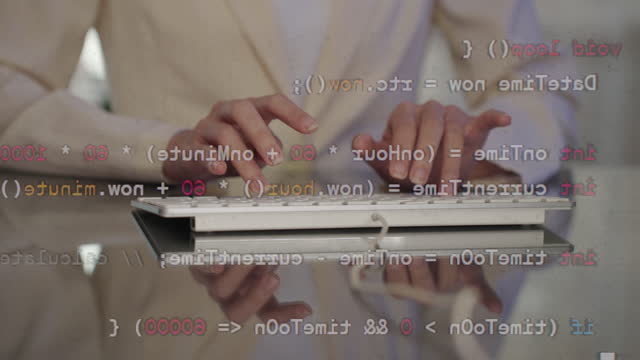 Close-up of hands of woman typing coding programming C++ language for microcontroller open-source hardware and software