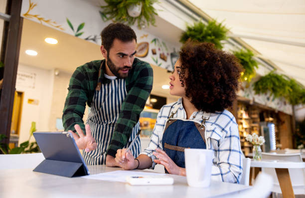 istock Business owners talking while doing the accountancy at a cafe 1482426143