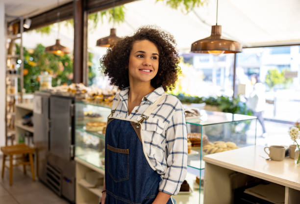 istock Happy waitress working at a cafe selling pastries 1482426193