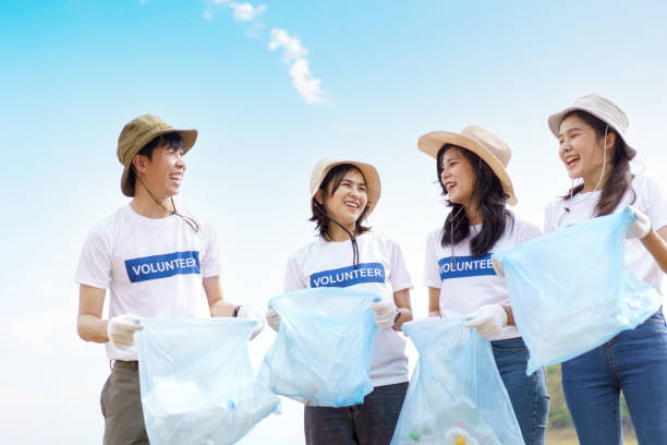Group of volunteer collecting a garbage.