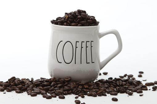 Coffee Beans in a coffee cup on white background