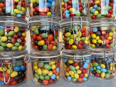 Colorful candy in glas jars at a candy store