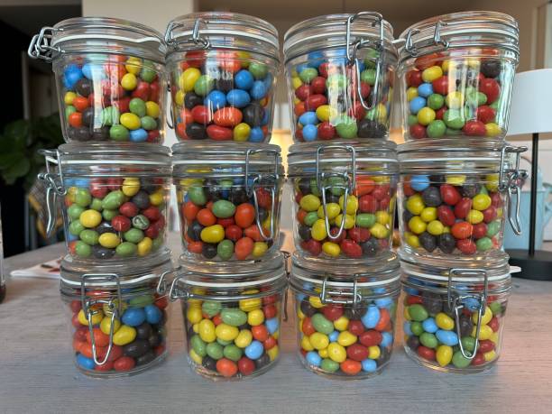 istock Colorful candy in glas jars at a candy store 1482428872