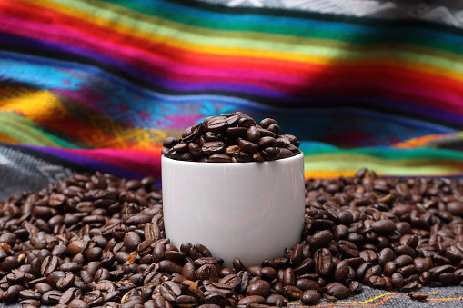 Coffee Beans in a cup with a bright colorful background