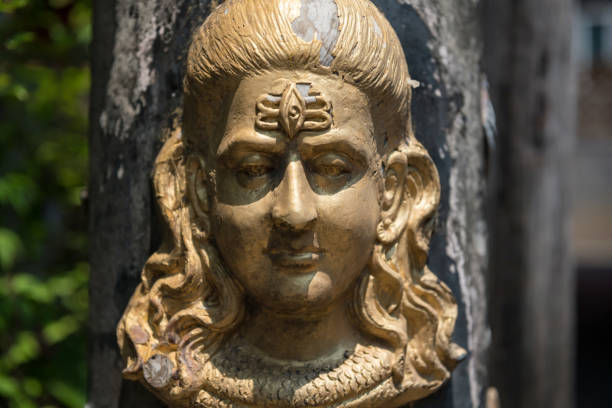 istock Hindu God golden Shiva Durga status attached on pillar 1482432650
