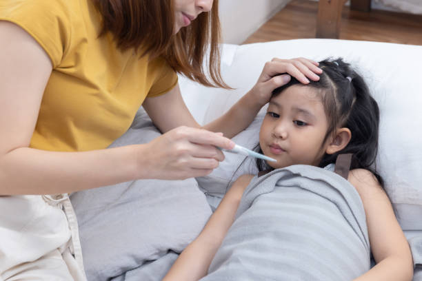 istock Mother Show Her Sick Daughter Body Temperature From Thermometer 1482436245