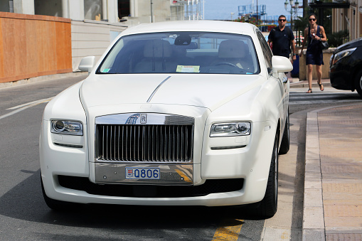 Fontvieille, Monaco - May 28, 2016: A beautiful and prestigious white Rolls-Royce parked on the street in Monte-Carlo, Monaco