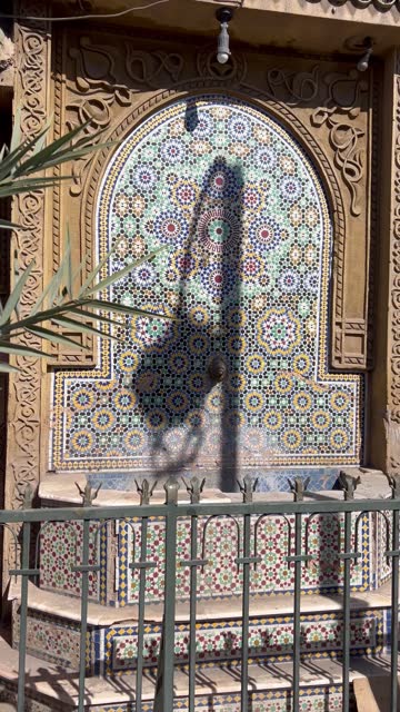 Moroccan mosaic Tile water fountain at Marrakech Medina roadside