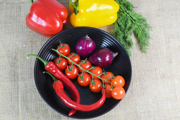 istock fresh vegetables in plate isolated on grey background 1482441629
