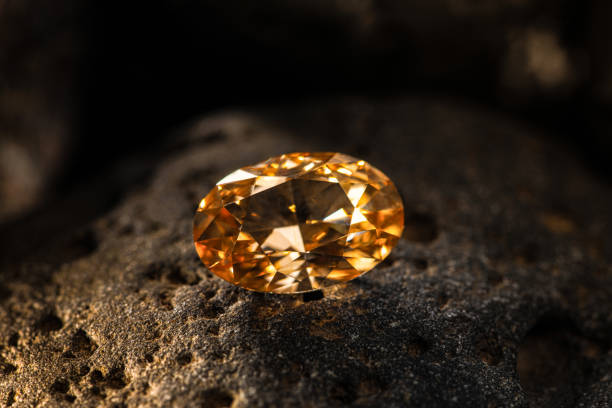istock Orange Sapphire Gemstone on Dark Background 1482444070