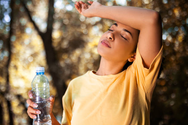 istock Young woman drinking water taking a break 1482449455
