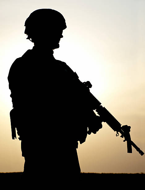 istock Silhouette of armed American soldier 148245531