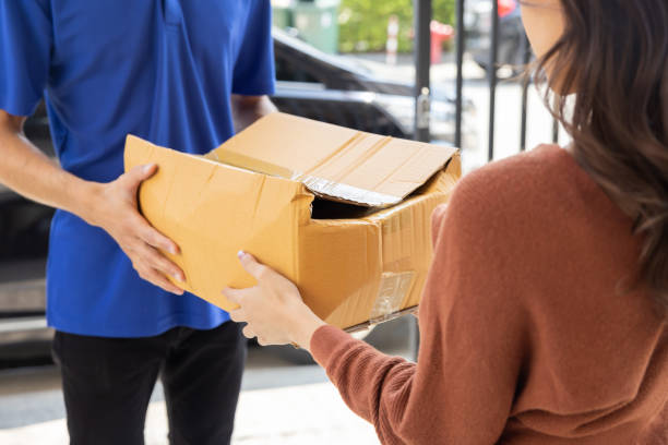 istock Delivery Man with Damaged Parcel Box Delivered to Customer 1482455776