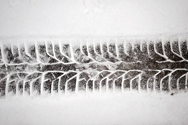istock Tire track in the fresh snow 148245951