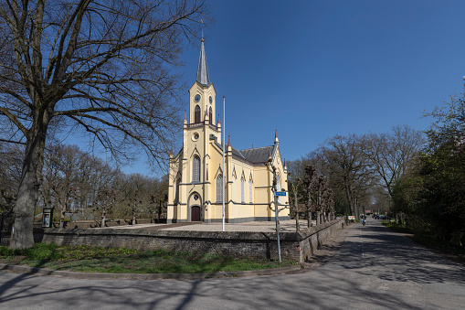 Neerijnen, Netherlands, April 5, 2023; Neo-Gothic cruciform church from 1865 in the small Dutch village of Neerijnen in Gelderland.