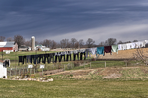 An Amish home has the laundry on the clothesline to dry.