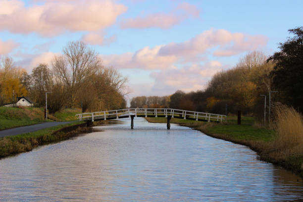 Park bridge in early winter Beautiful clouds over the park bridge in Delft delft winter netherlands snow stock pictures, royalty-free photos & images