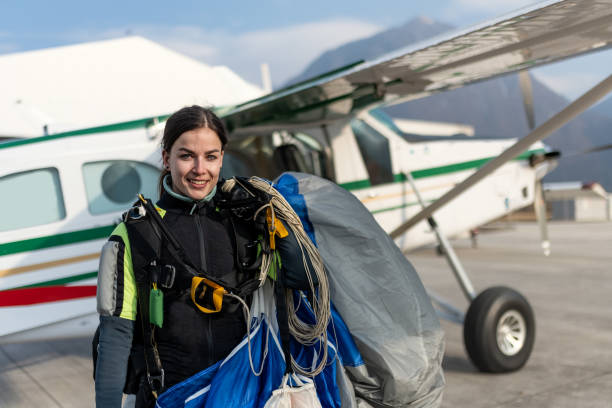 istock Skydiving woman touches the ground. 1482486964