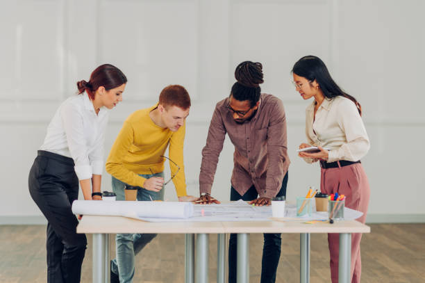 istock Diverse group of engineers or architects having a meeting in an office 1482487257