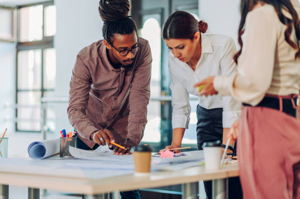 istock Arabic architect with dreadlocks having a meeting with his colleagues in an office 1482487274