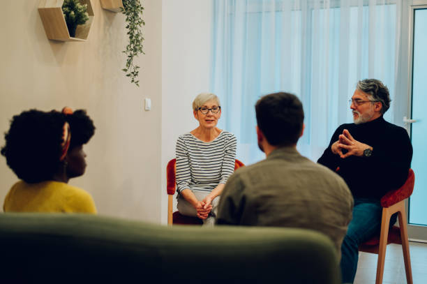 istock Multiracial people talking about their mental health on a group therapy session 1482487288