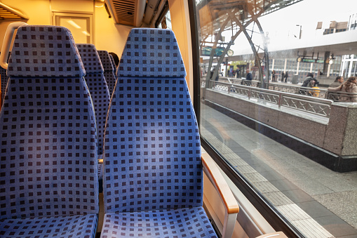 Picture of a typical seat from a European german train, empty, ready for a suburban service in Cologne train station, typical from Europe, in a modern regional DMU train.