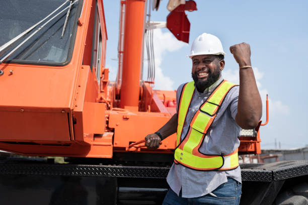 istock Confident African American Engineer man with crane truck background at site work 1482496547