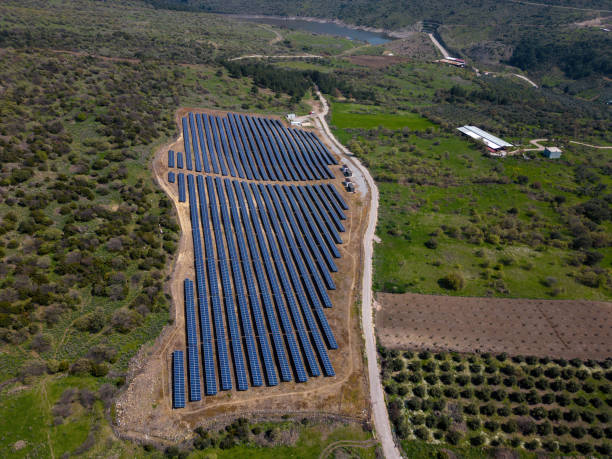 istock Aerial Solar Power Farm. Drone View Blue Photovoltaic Solar Panel Rows. 1482496607