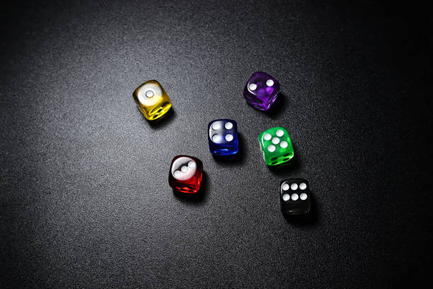 istock colorful dice pieces with random position on dark background 1482500009
