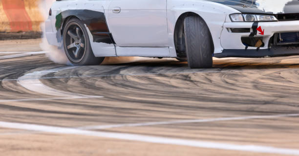 istock Drift car burning tires on speed track. 1482503903