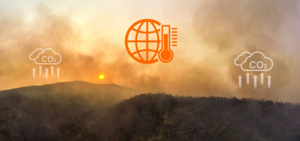 Wildfires release carbon dioxide (CO2) emissions and other greenhouse gases (GHG) that contribute to climate change and global warming. aerial view. stock photo