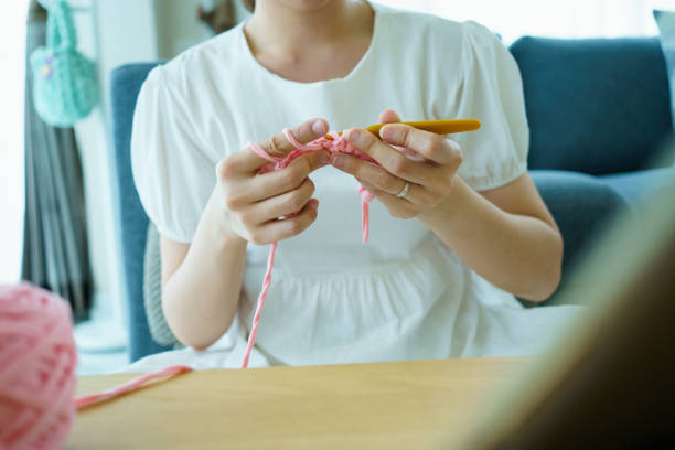 istock Woman crafting a crochet hat. 1482505617