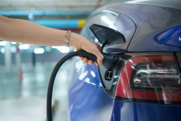 istock Woman charging the EV car. 1482505625