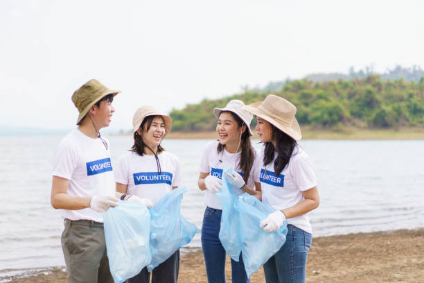 istock Group of volunteer collecting a garbage. 1482505629
