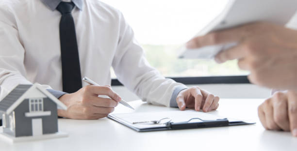 istock Real estate agent or sales manager has offered home sales and explained the terms 1482512295