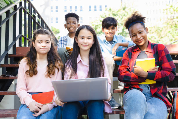 istock High school students of different races studying with laptops, diverse high school students 1482521334